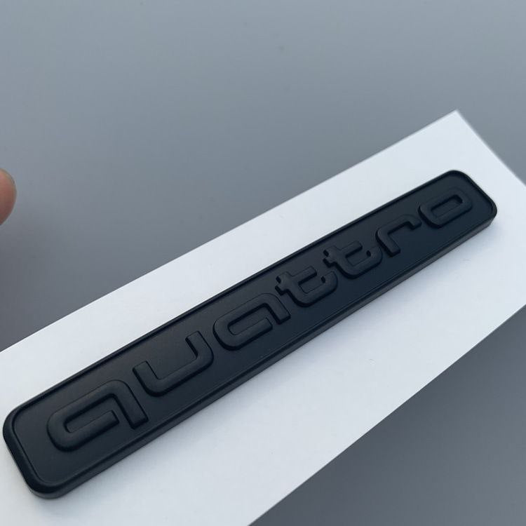 Емблема Quattro